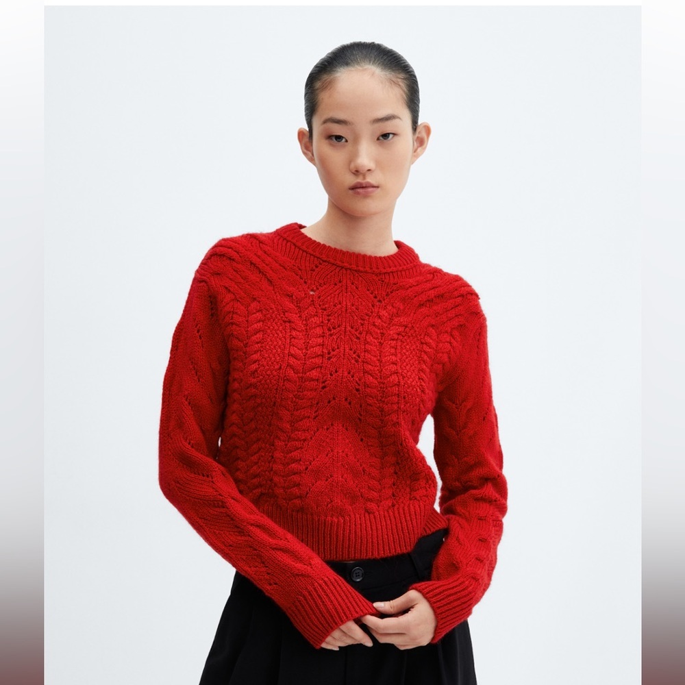 Knitted sweater with openwork details